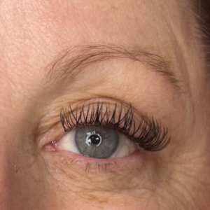 A woman's eyes showing a traditional lash expansion.